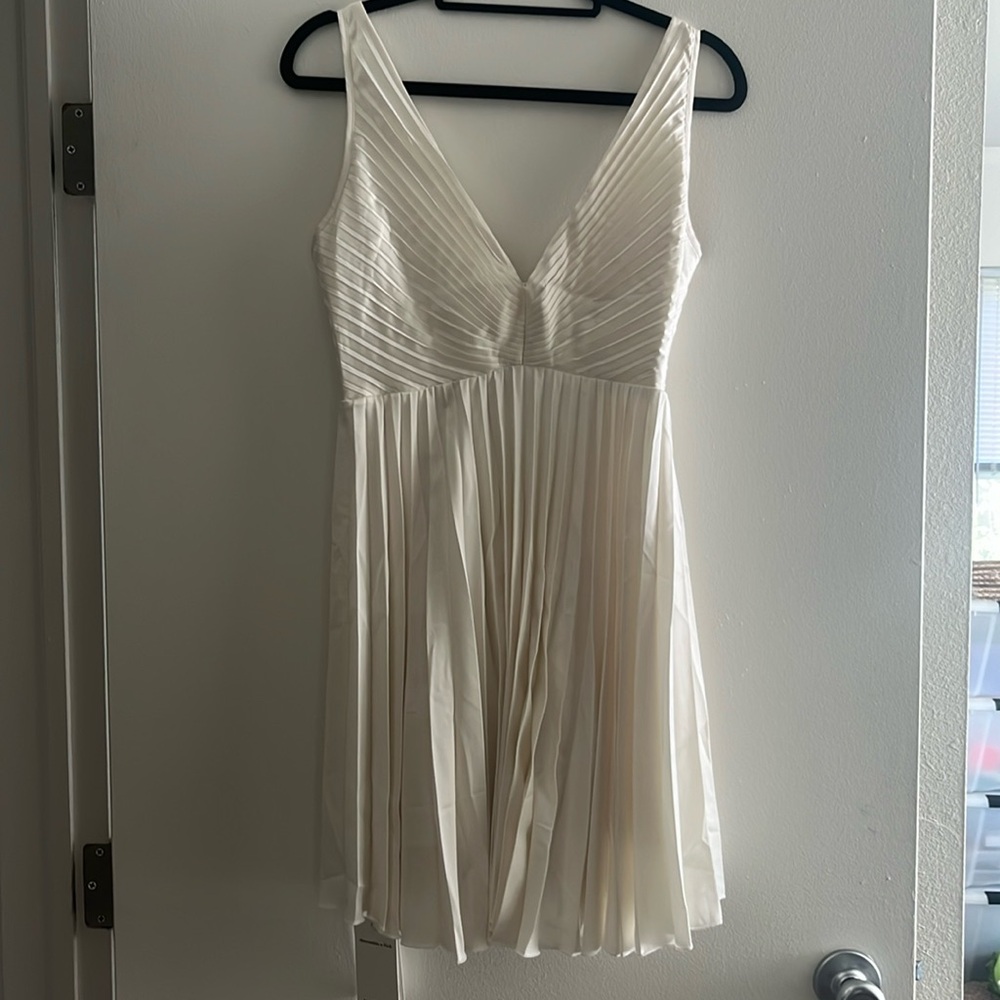 White pleated satin dress